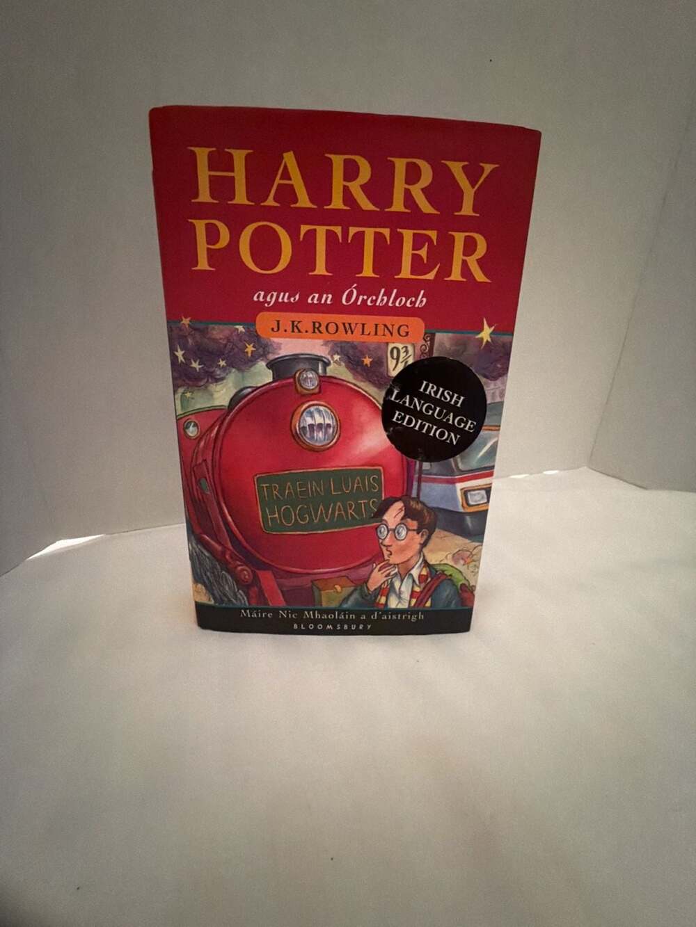 J.K. Rowling Harry Potter Agus An Orchloch Irish Edition
